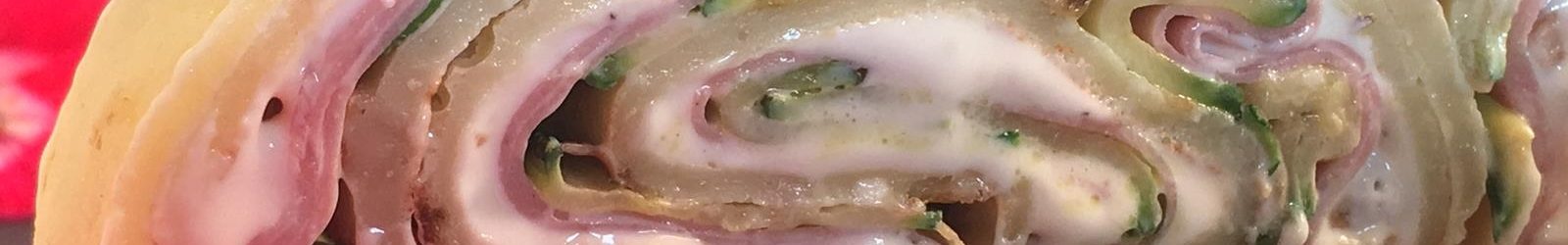 Rotolo di crespelle al parmigiano con mortadella e zucchine – videoricetta